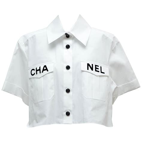 chanel white blouse with lace cutouts|Chanel tee shirts.